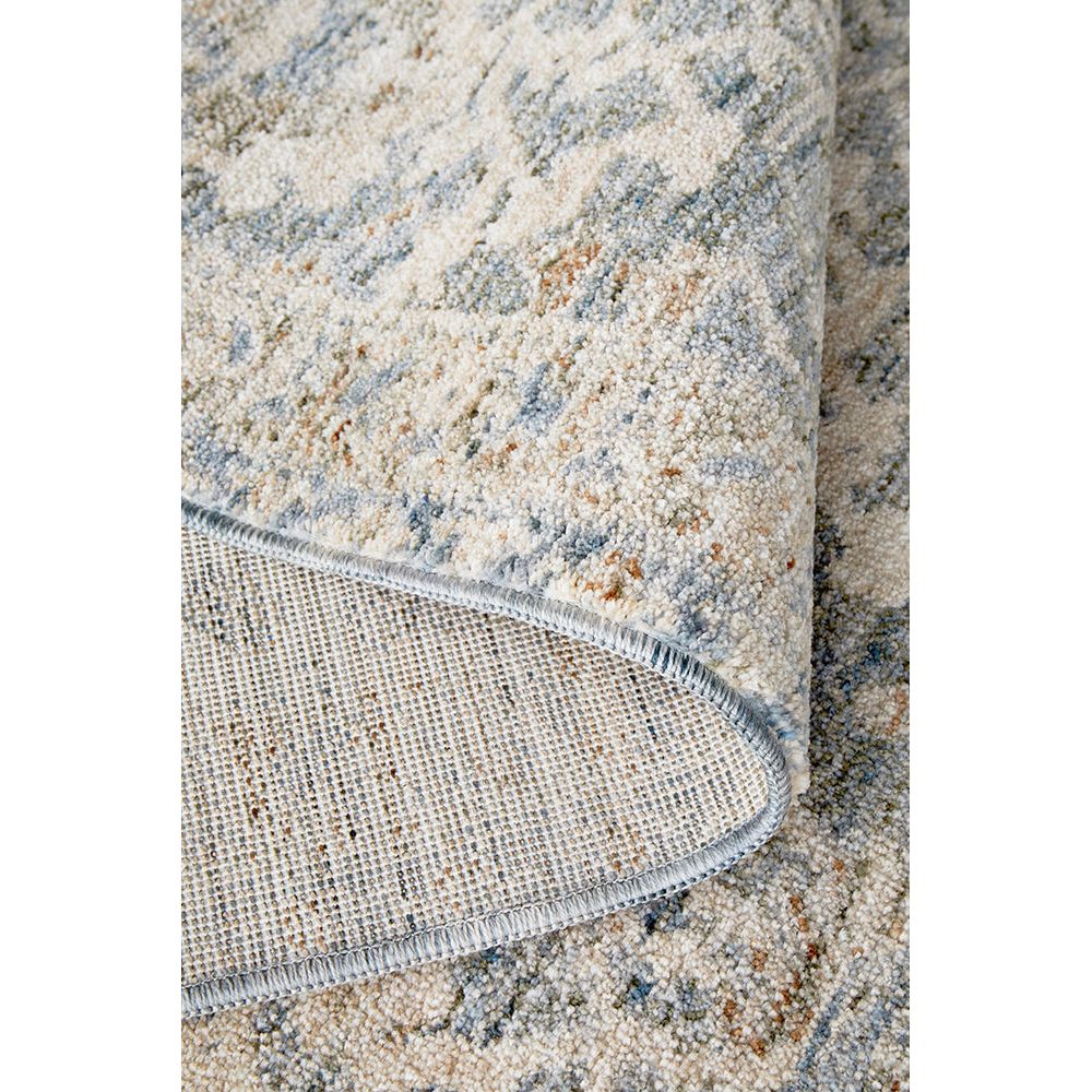 Close-up of a textured rug with a neutral color palette