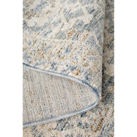 Close-up of a textured rug with a neutral colour palette
