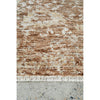 Textured brown and beige rug on a concrete floor