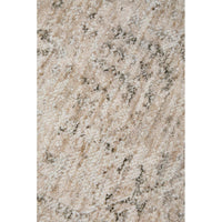 Close-up of a textured beige surface with black specks