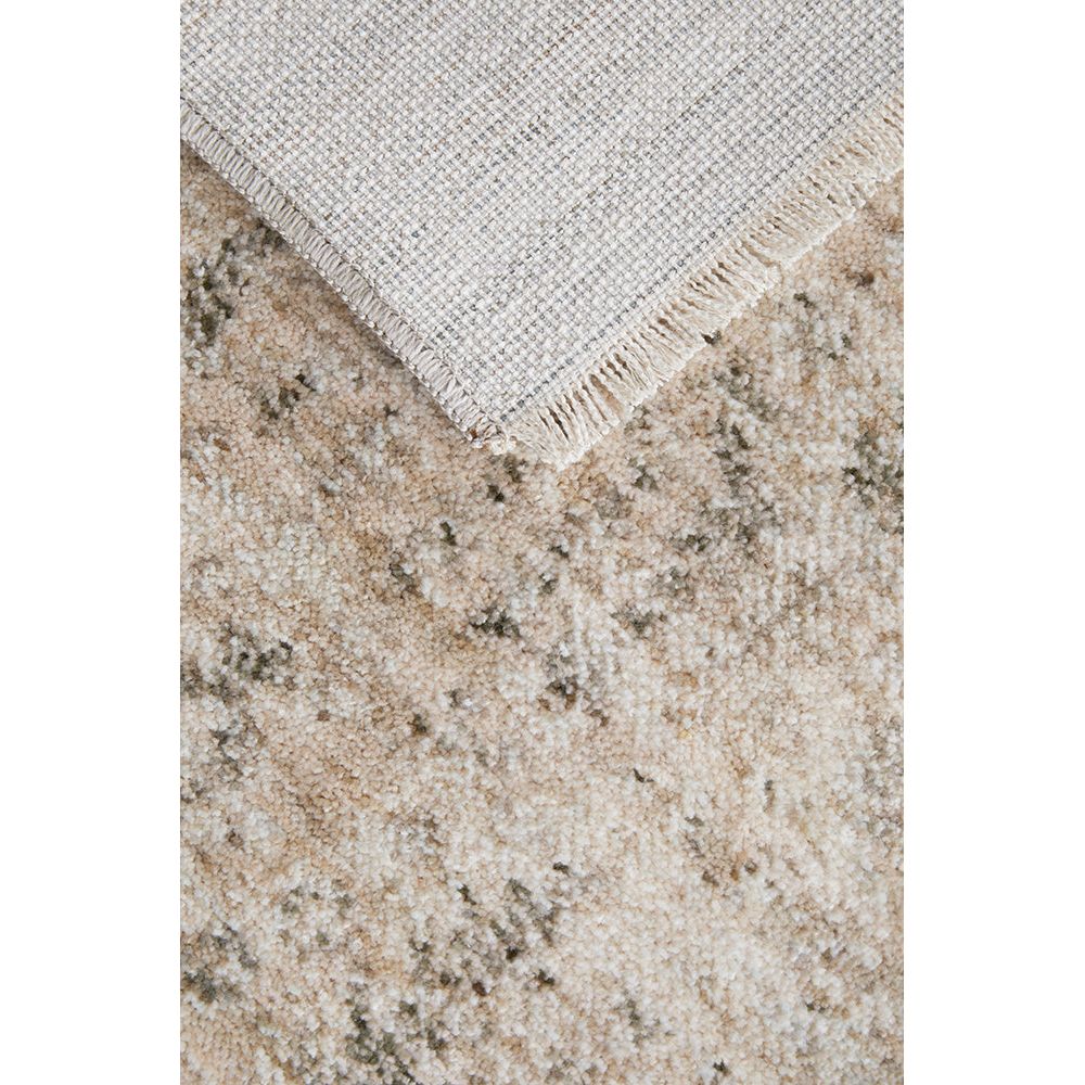 Close-up of a textured beige and brown rug corner with a light gray border.