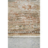 Textured area rug with earthy tones on a concrete floor