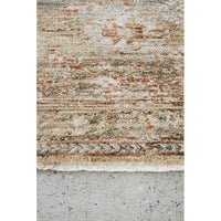Textured area rug with earthy tones on a concrete floor