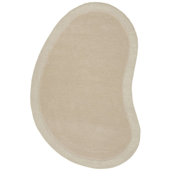 Curved bean-shaped beige wool rug with hand-tufted texture and soft wool fibers.