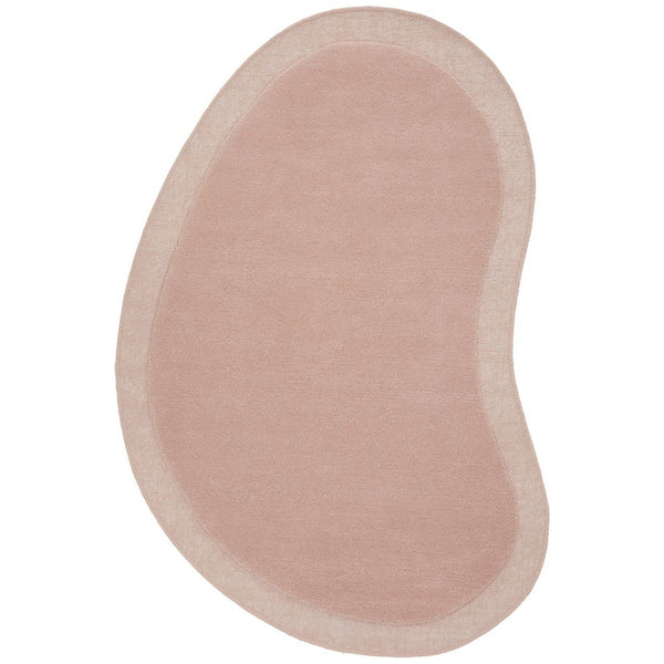 Pastel pink bean-shaped wool rug with curved modern design and soft texture.