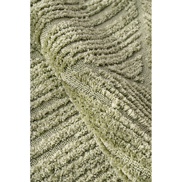Close-up of plush emerald green modern rug with textured diamond pattern and soft polyester pile.