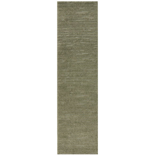 Long narrow emerald green rug with a subtle textured polyester pile and a modern design.