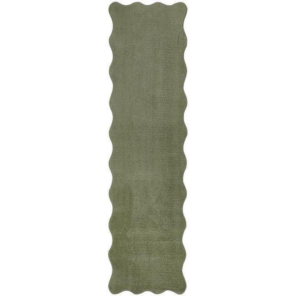 Green modern runner rug with wavy scalloped edges and a soft textured surface.
