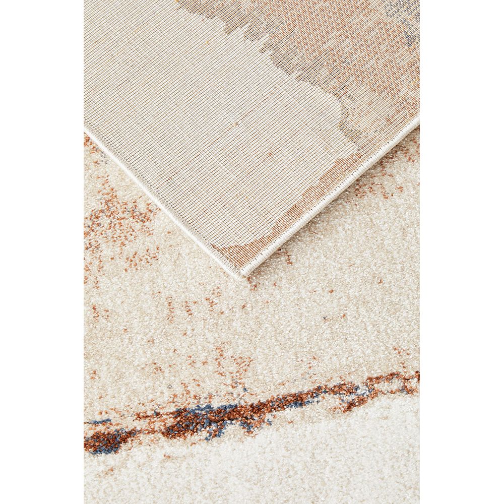 Beige area rug with a textured pattern.