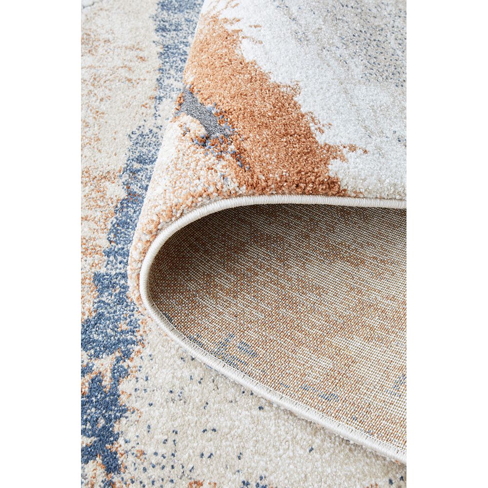 Close-up of a textured area rug with a multicolor pattern