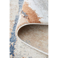 Close-up of a textured area rug with a multicolor pattern