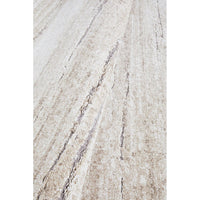 Close-up of a textured beige surface with subtle variations