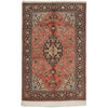 Decorative hand knotted Persian silk rug with intricate patterns and colors.