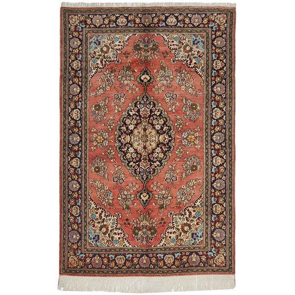 Decorative hand knotted Persian silk rug with intricate patterns and colors.