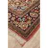 Decorative hand knotted Persian silk rug with intricate patterns on a wooden floor