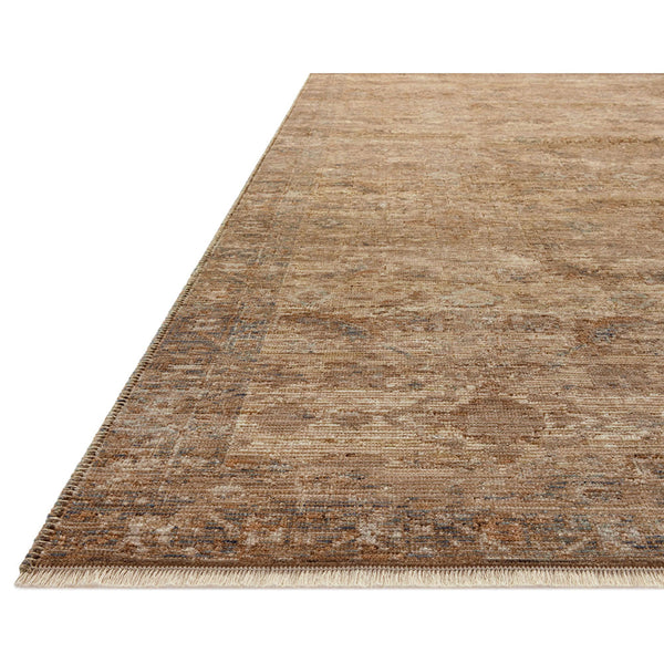 Neutral earth-toned transitional rug with subtle textured pattern and soft woven edges.