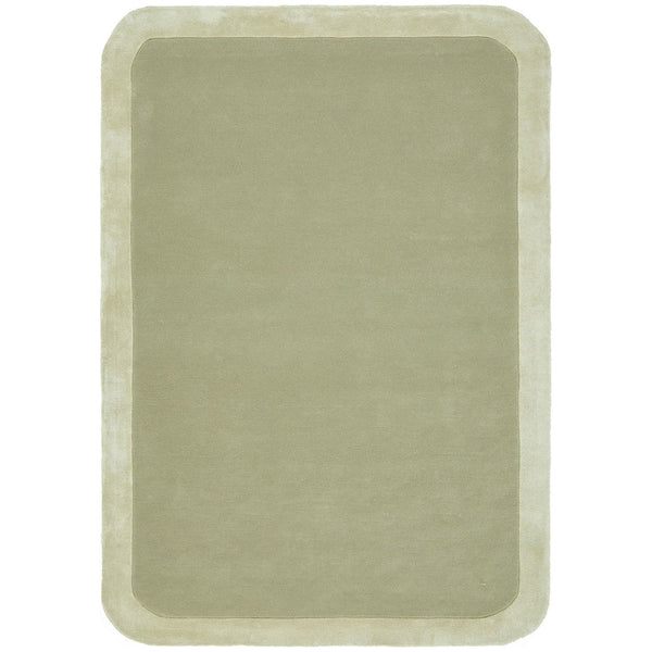 Soft green wool viscose rug with a subtle curved border and plush texture.