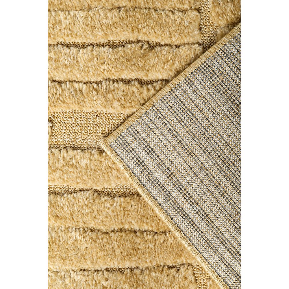Close-up of a textured gold rug with a geometric pattern.