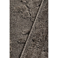 Close-up of textured brown rug with a woven pattern