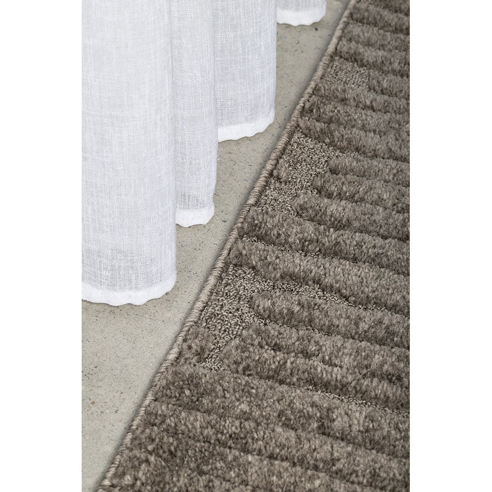 Gray textured rug on a white background