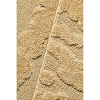 Close-up of a textured gold rug on a white background
