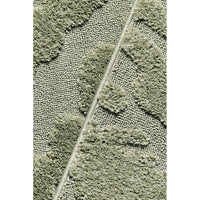 Close-up of a textured green runner rug