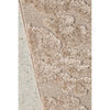 Textured beige rug on a concrete floor