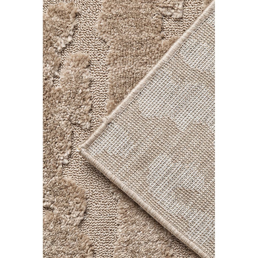 Close-up of a textured beige rug with a border