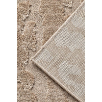 Close-up of textured beige rug corner