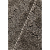 Close-up of a textured brown fabric surface