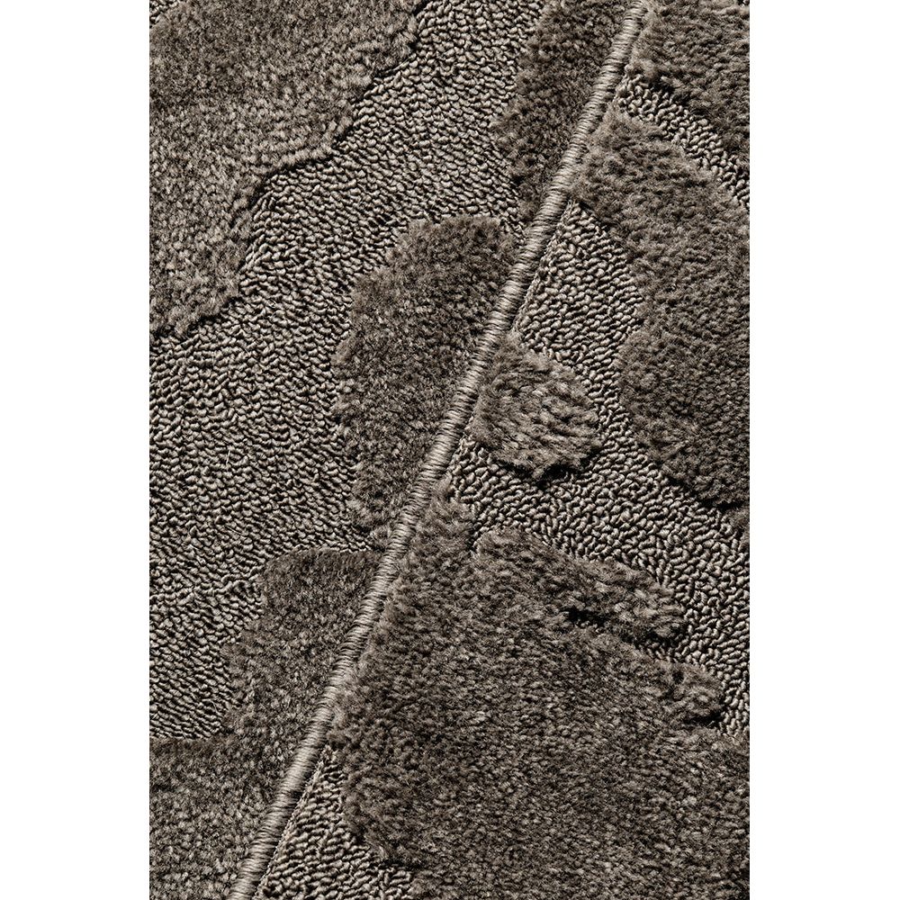 Close-up of a textured brown fabric surface
