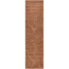 Rust coloured textured runner rug on a white background
