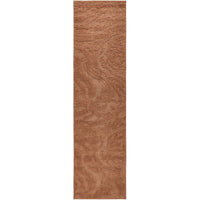 Rectangular rust coloured rug on a white background