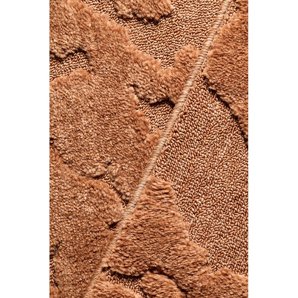 Close-up of a rust coloured textured rug