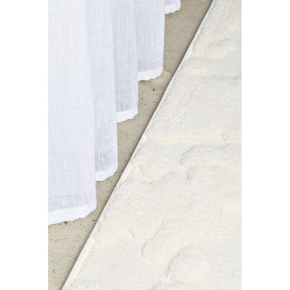 Close-up of white textured runner rug