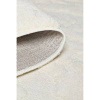 Close-up of a white textured rug corner