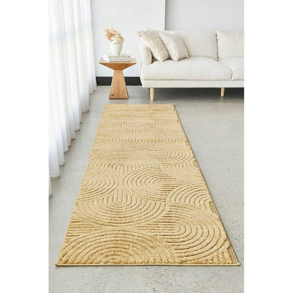 Golden runner rug with modern geometric textured swirl pattern on polyester pile.