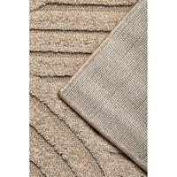 Close-up of textured beige rug corner