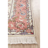 Decorative rug with floral and bird patterns on a wooden floor