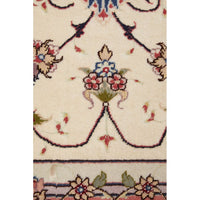 Close-up of a patterned rug with floral designs and intricate details.