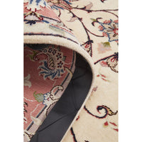 Close-up of a patterned rug with intricate designs.