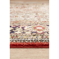 Multicolored patterned Hand Knotted Silk Rug on a wooden floor