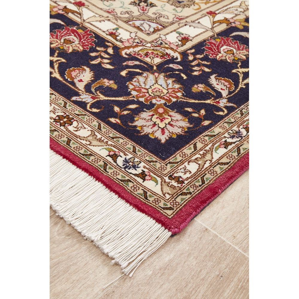 Decorative Persian rug with intricate patterns on a wooden floor