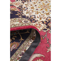 Close-up of a patterned Persian wool rug with intricate designs and vibrant colors.