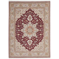 Decorative Persian wool rug with intricate patterns in red and beige