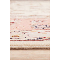 Close-up of a patterned Persian wool rug with floral patterns on a light background