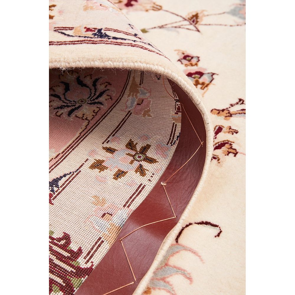 Close-up of a patterned Persian wool rug with intricate designs