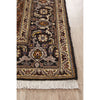 Decorative Persian wool rug with intricate patterns on a wooden floor