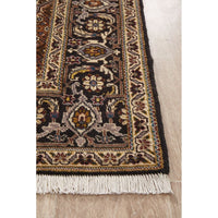 Decorative Persian wool rug with intricate patterns on a wooden floor