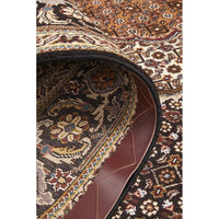 Close-up of a patterned Persian wool rug with intricate designs.